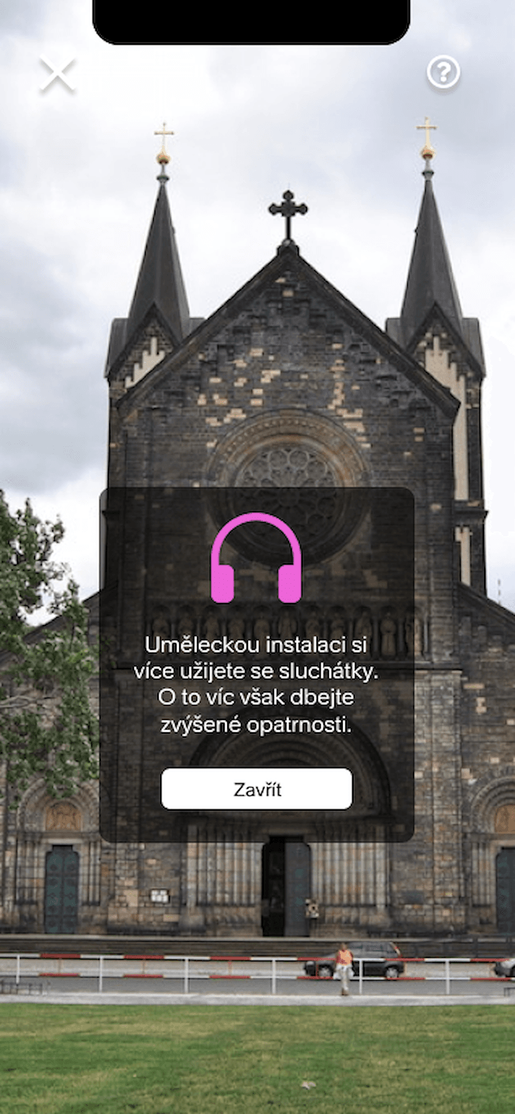 In-app prompt recommending headphones and reminding visitors to be careful